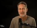 Mark Hyman standing in front of a microphone.